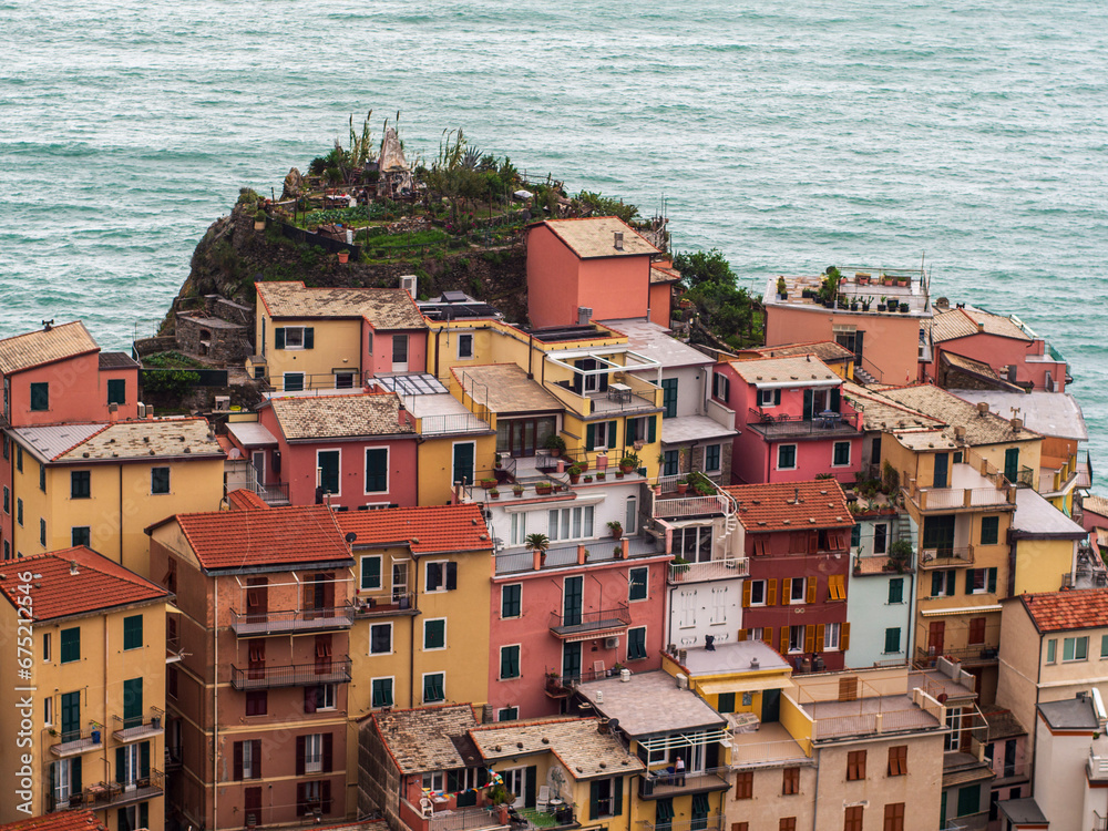 Aerial View of Manarola Old Town: Panoramic Seascape with Elevated colored Houses Aerial View of Manarola Old Town: Panoramic Seascape with Elevated colored Houses