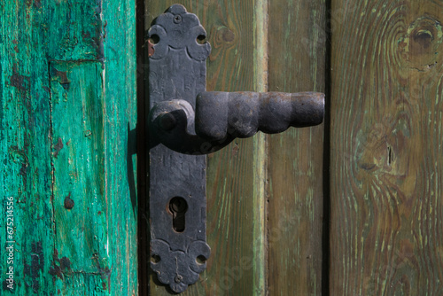 Dettaglio della maniglia di una porta di una casa a Forno di Zoldo nelle Dolomiti bellunesi photo