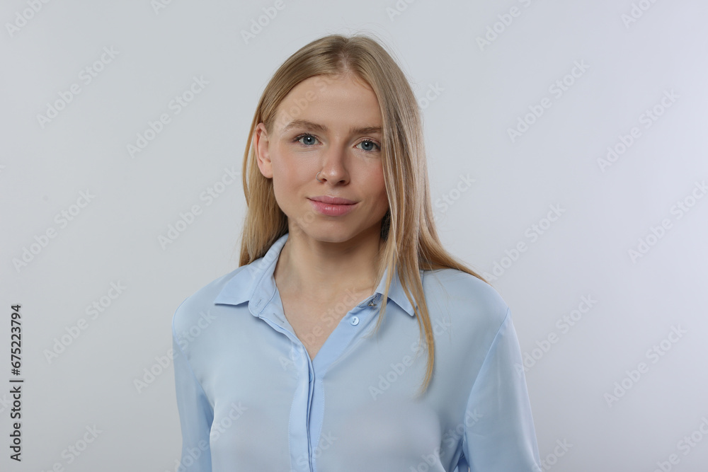 Portrait of beautiful young woman in stylish blouse on white background Portrait of beautiful young woman in stylish blouse on white background