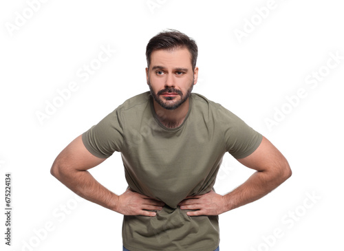 Man suffering from stomach pain on white background