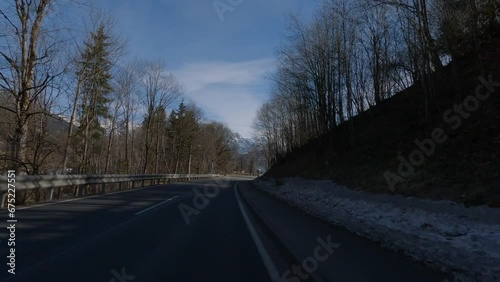 POV FRONT VIEW DRIVING PLATE car driving on winter roads in Austrian Alps (ID: 675227551)