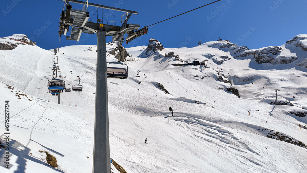 The cableway to mount Titlis over Engelberg on the Swiss alps The cableway to mount Titlis over Engelberg on the Swiss alps