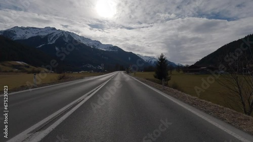 POV FRONT VIEW DRIVING PLATE car driving on winter roads in Austrian Alps (ID: 675230123)