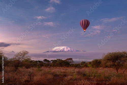 Amboseli National Park with a view of the snow summit of Kilimanjaro in Kenya. Safari Hot air balloon experience in the early morning photo
