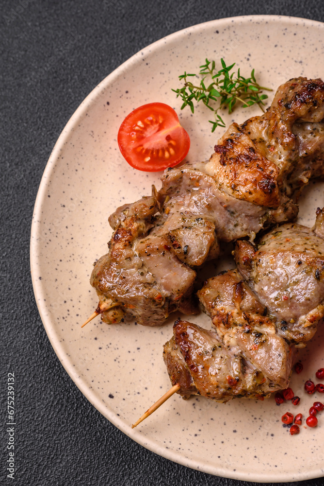 Delicious fried shish kebab of chicken or pork meat with salt, spices and herbs