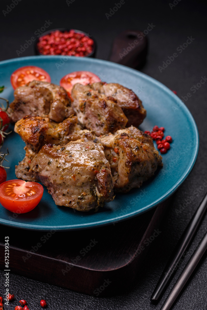 Delicious fried shish kebab of chicken or pork meat with salt, spices and herbs