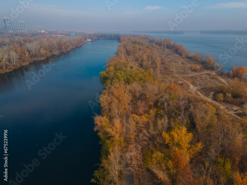 The rowing canal spit on Pobeda in the city of Dnipro from above. River View. Autumn colors. Drone photography. A place for a walk in the city. photo