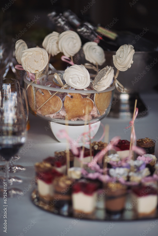 Tasty desserts, cakes and pastry on the wedding sweet buffet. Delicious wedding reception candy bar dessert table Tasty desserts, cakes and pastry on the wedding sweet buffet. Delicious wedding reception candy bar dessert table
