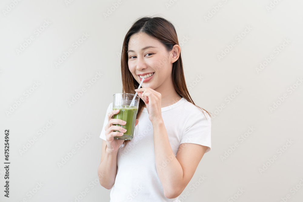 young woman drinking detox drink made by vegetable and fruit mixed. young woman drinking detox drink made by vegetable and fruit mixed.