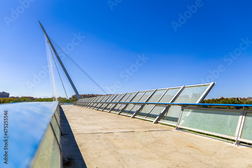 Fototapeta Naklejka Na Ścianę i Meble -  Pasarela del voluntariado. Modern bridge crossing the river Ebro in Zaragoza. Modern architecture