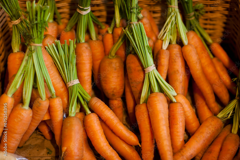Close up of a basket filled with trimmed bunches of carrots
Close up of a basket filled with trimmed bunches of carrots