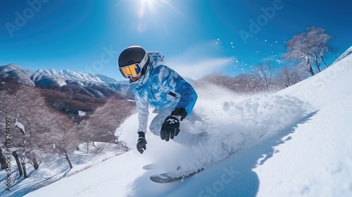 male snowboarder in goggles and helmet riding a snowboard on a snowy slope in the mountains, winter sport, athlete, lifestyle, vacation, man, speed