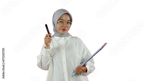 Beautiful Indonesian Muslim woman wearing a hijab works as a private teacher