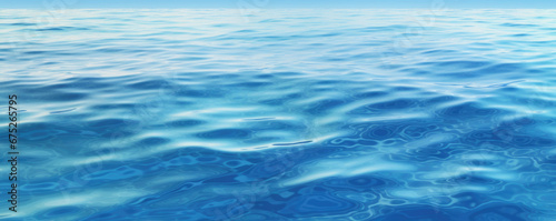 Blue sea water surface with sun glare and ripple background