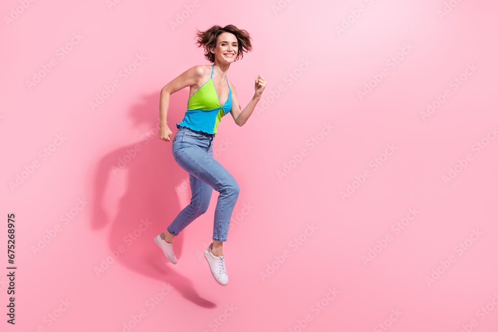 Full body photo of jumping running fast funny girl to buy last piece product with discount proposition isolated on pink color background Full body photo of jumping running fast funny girl to buy last piece product with discount proposition isolated on pink color background