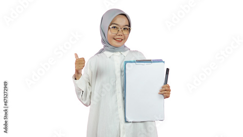Beautiful Indonesian Muslim woman wearing a hijab works as a private teacher