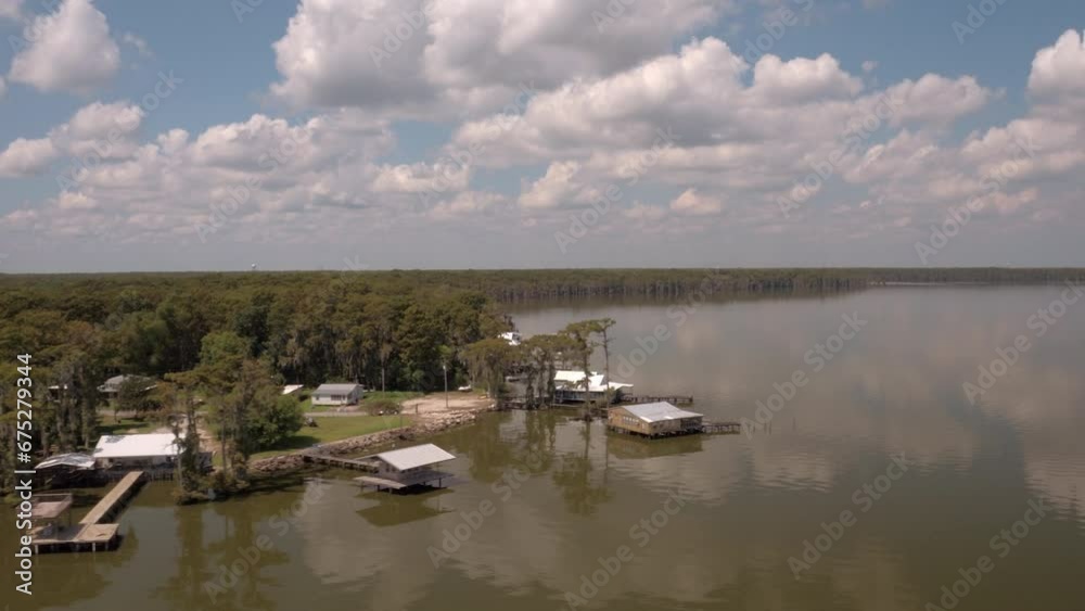 Aerial Panning Beautiful View Of Green Trees By Clouds, Drone Flying Under Clouds On Sunny Day - Bayou, Louisiana Aerial Panning Beautiful View Of Green Trees By Clouds, Drone Flying Under Clouds On Sunny Day - Bayou, Louisiana