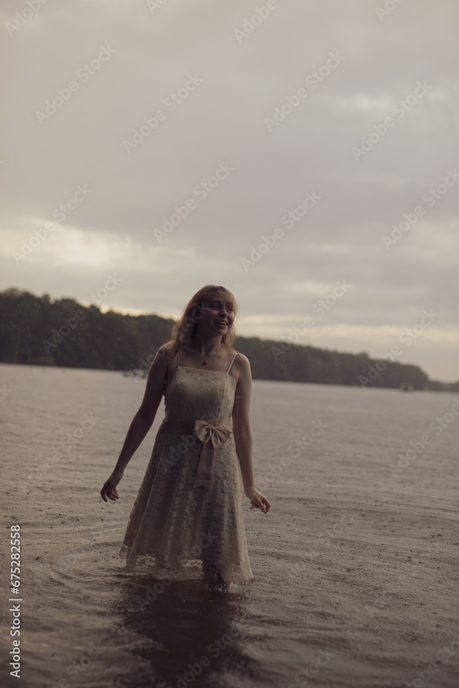 young shy cosplay woman in dress on an rainy day on sea young shy cosplay woman in dress on an rainy day on sea