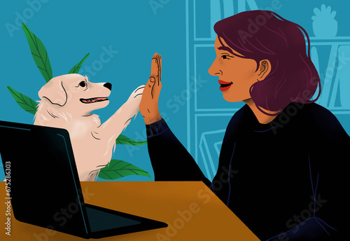 Happy woman high fiving with dog at laptop
