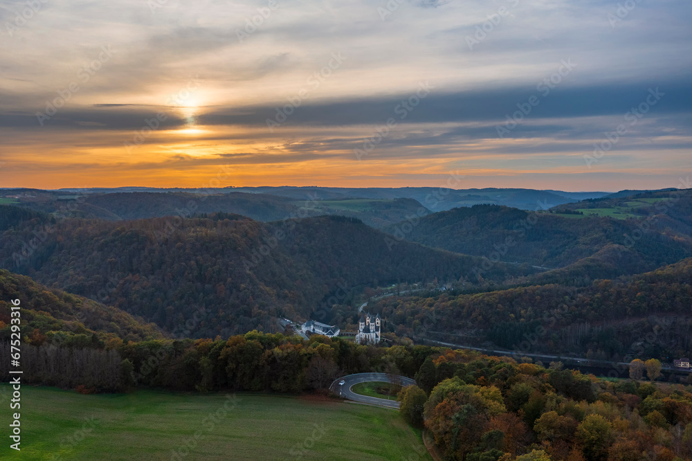 Fototapeta premium Bird's-eye view of the Arnstein Monastery near Oberhnhof/Germany on the Lahn at sunset