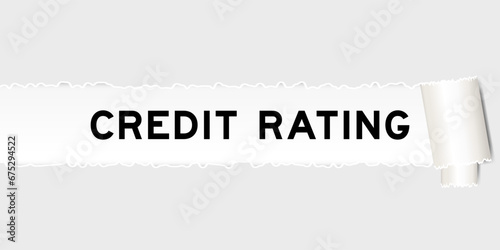 Ripped gray paper background that have word credit rating under torn part