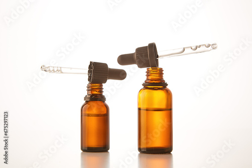 Two amber dropper vials with aromatherapy essence.
