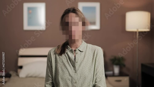 Hidden identity, hidden face, unknown person, silhouette interview. Woman talking to an interlocutor or looking at camera, her face is hidden