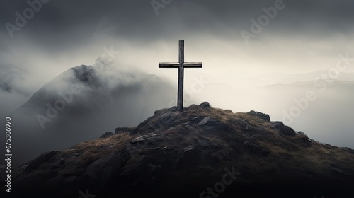 A cross on top of a misty mountain. Religious concept, cross on the top