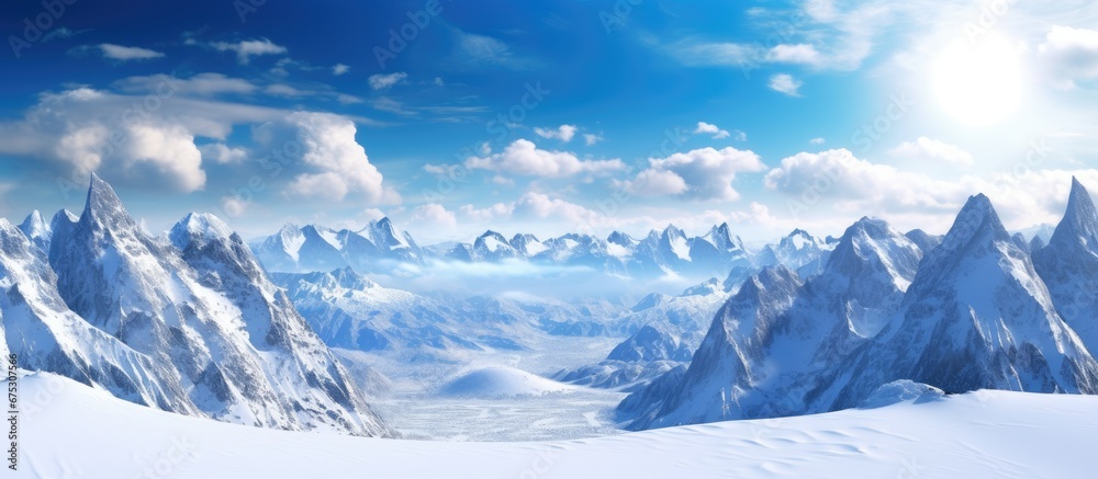 The winter landscape with mountains covered in white snow surrounded by blue skies and fluffy clouds creates a breathtaking background for nature enthusiasts and sports lovers who enjoy tra