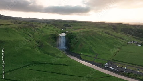 Skogafoss, South Iceland - Circling Around the Tumbling Waterfall in the Midst of Summer - Aerial Drone Shot photo