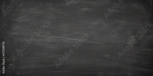 Gritty vintage black grunge surface texture. Rough textured old chalkboard dark background. Weathered stone. Blackboard style. Gray slate for design