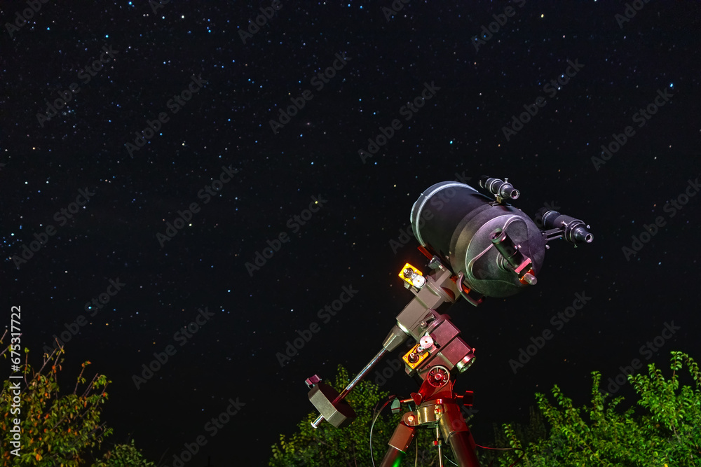 Naklejka premium The astronomical telescope is aimed at the sky and is ready for stargazing. Observation and study of stars and space objects at night