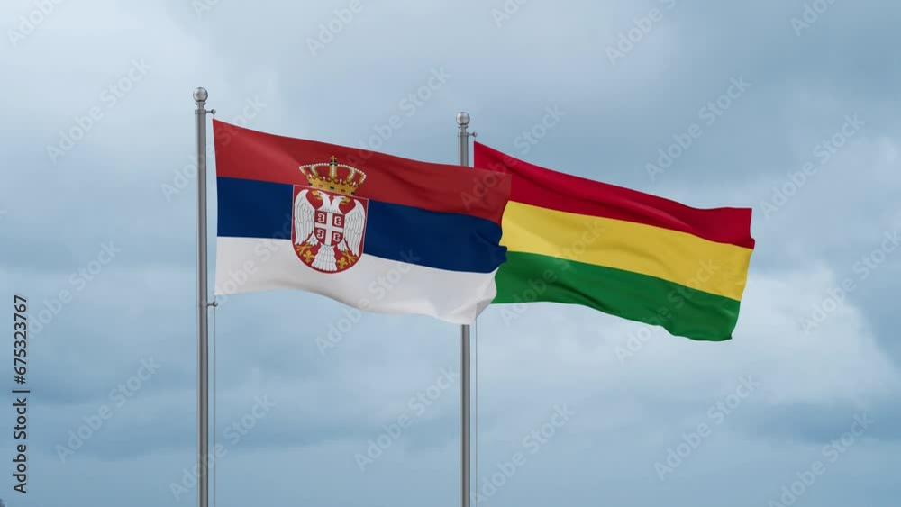 Bolivia flag and Serbia flag waving together on cloudy sky, endless seamless loop, two country relations concept Bolivia flag and Serbia flag waving together on cloudy sky, endless seamless loop, two country relations concept