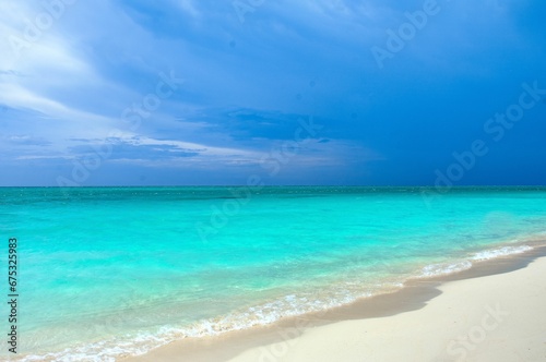 Fototapeta Naklejka Na Ścianę i Meble -  Sandy beach with pristine white sand against the crystal blue water