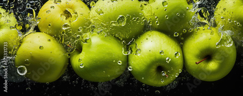 Green fresh apples with sprinkled water top view. Apples washed in water.