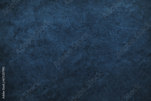 Texture of blue polished concrete background. Dark old wallpaper with rough cement texture. Empty grunge wall concept or floor backdrop. Abstract surface mockup. Top view, close up, copy space photo