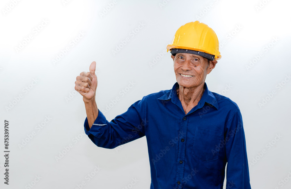 Old male architect contractor wearing yellow hardhat, smile expression as working concept
