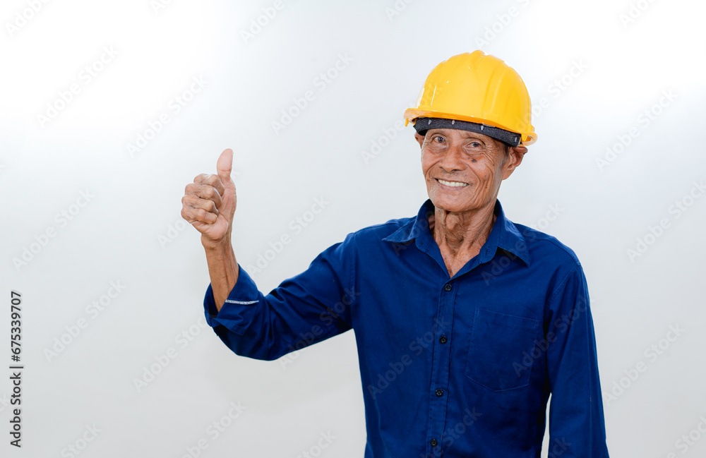 Old male architect contractor wearing yellow hardhat, smile expression as working concept Old male architect contractor wearing yellow hardhat, smile expression as working concept
