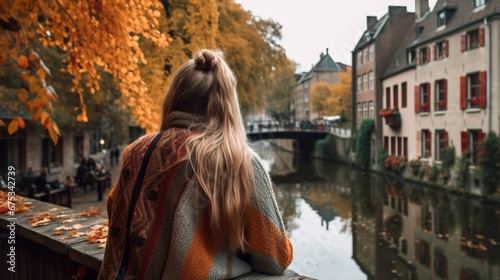 Woman sightseeing in a cozy small town in Autumn 