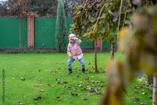 little child playing in the garden