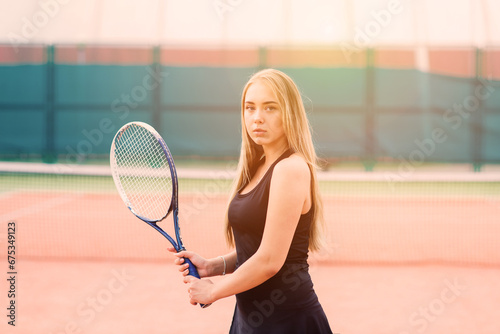Tennis tournament. Female player at the clay tennis court