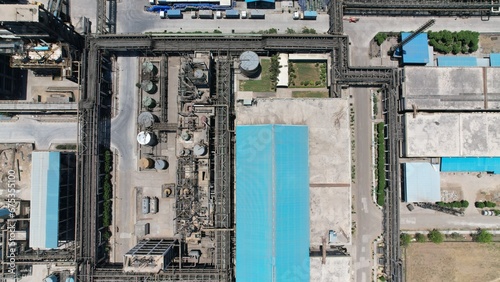 Chemical energy industry site power manufacturing factory pipe gas line top drone view smoke air pollution © LAKSHMANA