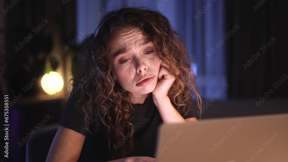 Portrait of boring young curly woman scrolling on laptop computer while find incredible news promotion sale and extremely happy at late night at home Advise Approve Recommend Choice concept Portrait of boring young curly woman scrolling on laptop computer while find incredible news promotion sale and extremely happy at late night at home Advise Approve Recommend Choice concept