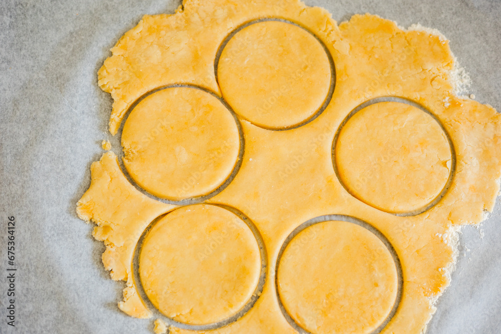 pastry-making with this captivating image featuring a close-up of perfectly cut shortcrust dough circles in a kitchen setting
