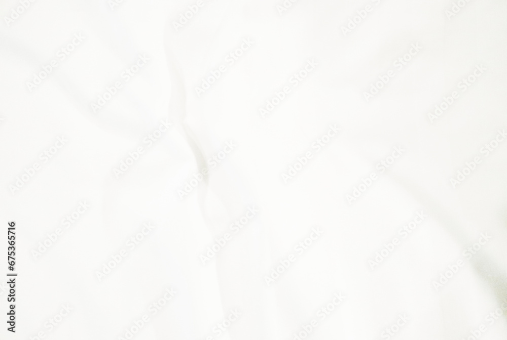 Obraz premium abstract white fabric background. soft and smooth creased silk cloth as wave for graphic design element
