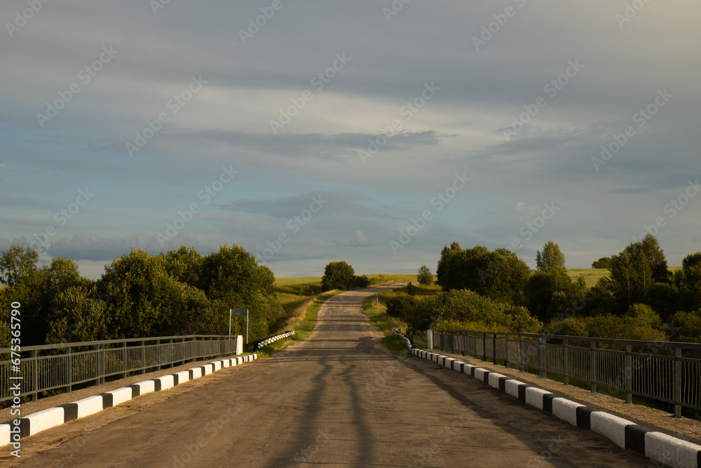 Fototapeta premium The old road rests against the sky. The old road.