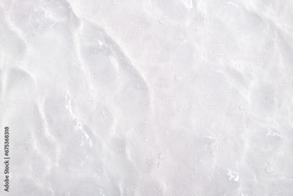 Cosmetic gel, serum transparent sample. Liquid cream with bubble texture. Gel texture of a cosmetic product. Clear liquid lotion for skin care. Cosmetic gel, serum transparent sample. Liquid cream with bubble texture. Gel texture of a cosmetic product. Clear liquid lotion for skin care.