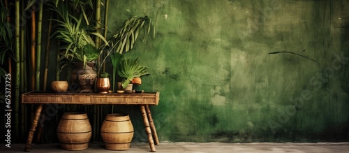 The old wooden table against the grungy wall in the background adds a beautiful tropical touch to the room with its organic bamboo pattern and natural texture creating a jungle inspired dec