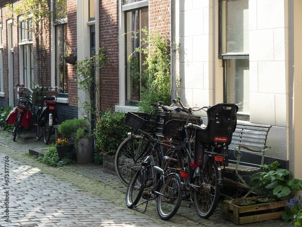 Vibrant street scene of the city of Haarlem in the Netherlands showcasing a row of bicycles parked