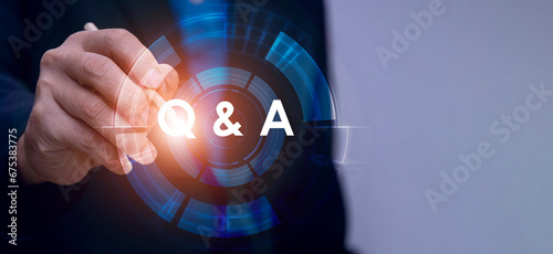 Businessman clicks the question and answer or question and answer button.